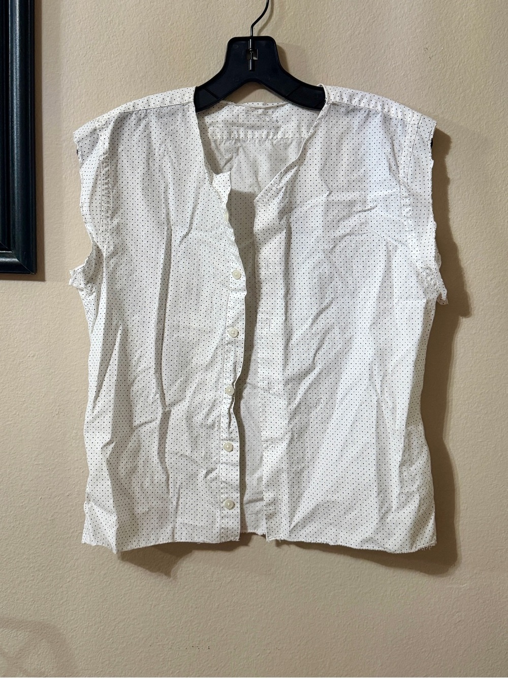 Sleeveless White Button-Front Blouse with Micro Dot Pattern